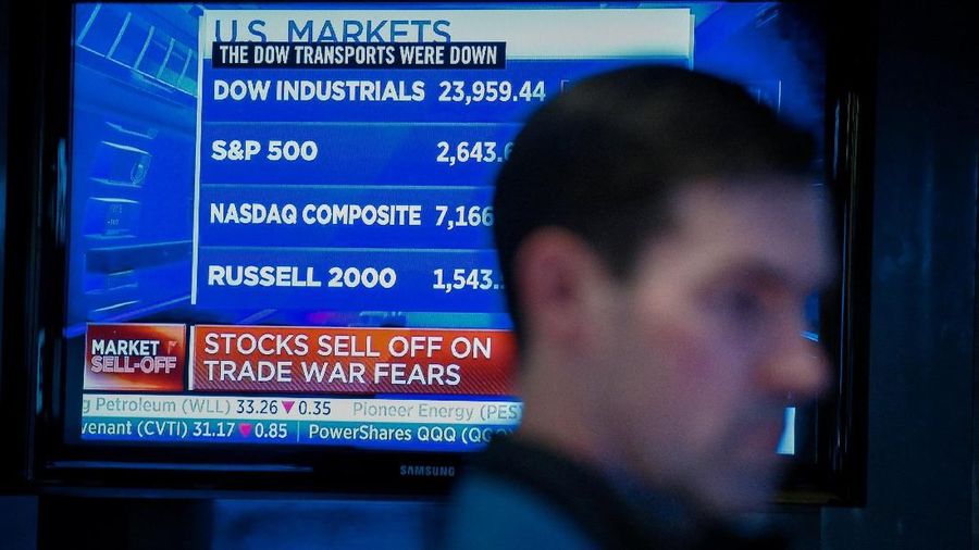 A trader works on the floor of the New York Stock Exchange, (NYSE) in New York, U.S., March 22, 2018. REUTERS/Brendan McDermid