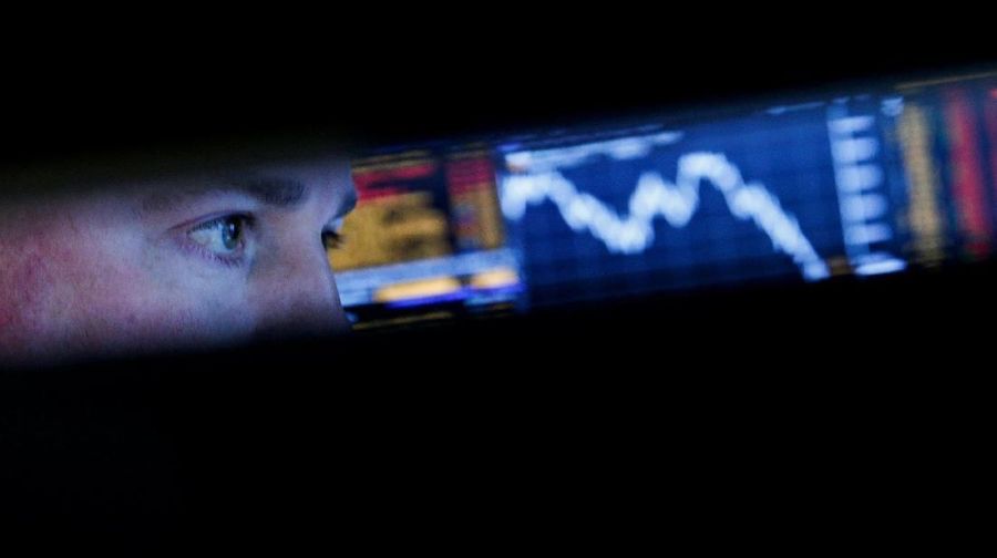 A specialist trader works at his post on the floor of the New York Stock Exchange, (NYSE) in New York, U.S., March 22, 2018. REUTERS/Brendan McDermid