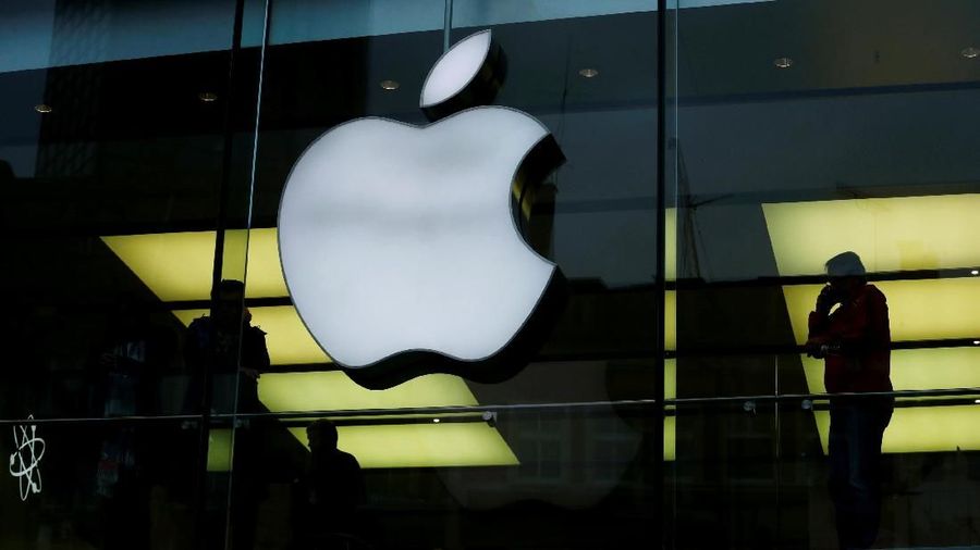 FILE PHOTO: An Apple logo is seen on the building's facade as activists from the anti-globalisation organisation Attac hold the protest against alleged tax evasion by Apple company in front of an Apple store in Frankfurt, Germany, March 10, 2018. REUTERS/Ralph Orlowski/File Photo