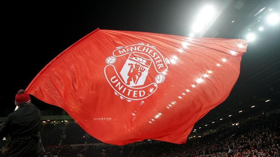 Soccer Football - Champions League Round of 16 Second Leg - Manchester United vs Sevilla - Old Trafford, Manchester, Britain - March 13, 2018 A Manchester United flag is waved before the match REUTERS/David Klein