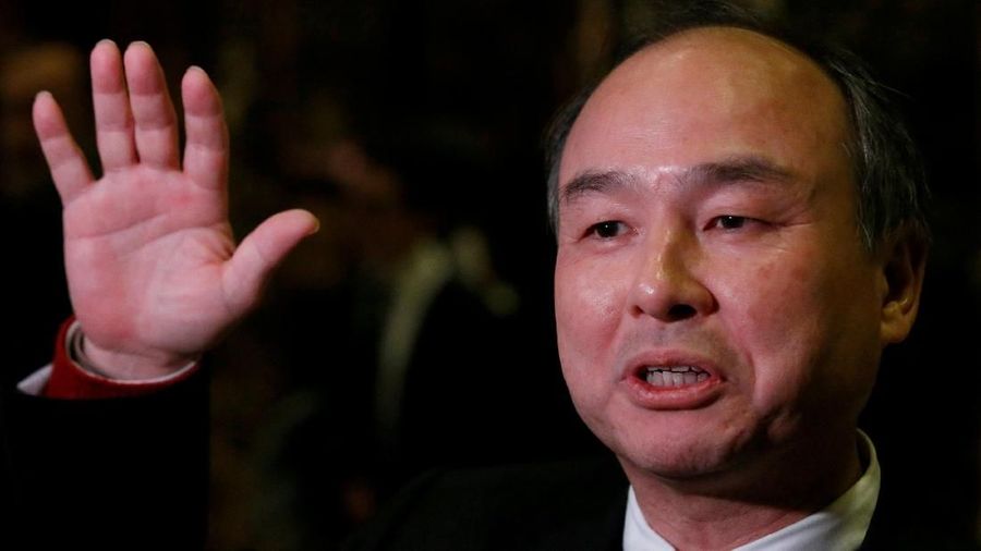 FILE PHOTO: Softbank CEO Masayoshi Son speaks to the press after meeting with U.S. President-elect Donald Trump at Trump Tower in Manhattan, New York City, U.S., December 6, 2016. REUTERS/Brendan McDermid/File Photo