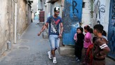 Gaza tidak selalu suram. Di tengah keidentikannya dengan perang dan kesengsaraan, ada karya seni yang memberi warna berbeda. (REUTERS/Ibraheem Abu Mustafa)