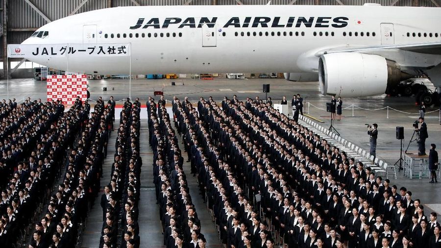 Newly-hired employees of Japan Airlines (JAL) group attend the company group's initiation ceremony at a hangar of Haneda airport in Tokyo, Japan, April 2, 2018.  REUTERS/Issei Kato