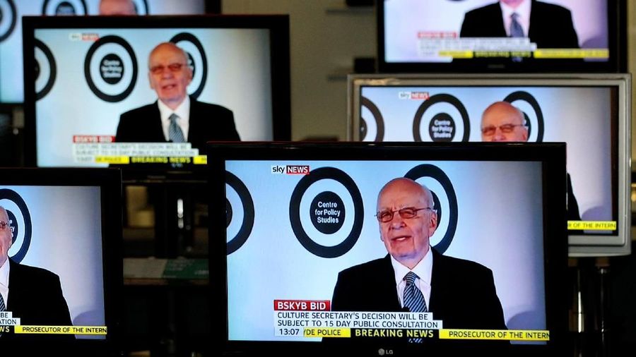 FILE PHOTO: The current Executive Chairman of News Corporation and Executive Co-Chairman of Twenty-First Century Fox, Rupert Murdoch is seen talking on Sky News on television screens in an electrical store in Edinburgh, March 3, 2011. REUTERS/David Moir/File Photo