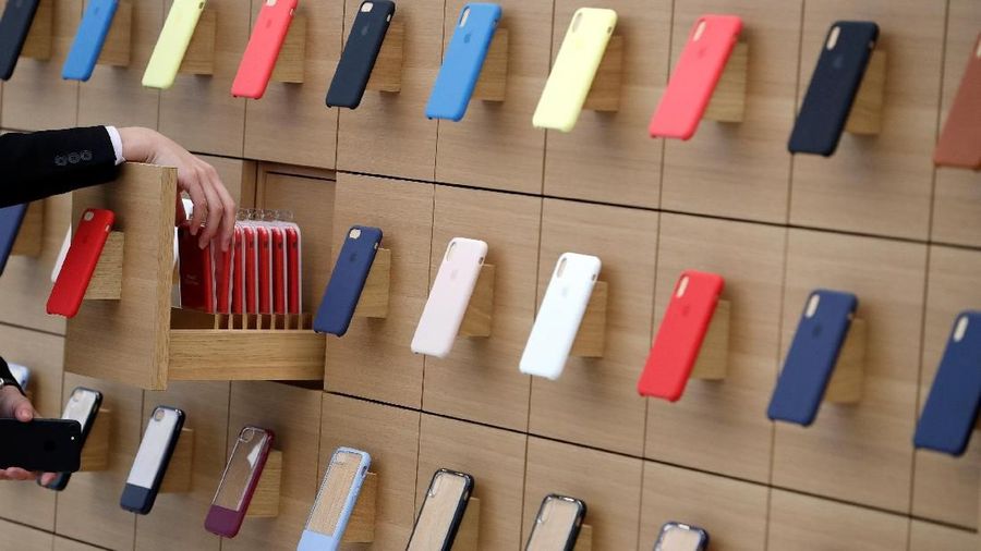 iPhone cases are displayed on a wall at the Apple Shinjuku store during a press preview ahead of it's grand open in Tokyo, Japan April 5, 2018.  REUTERS/Issei Kato