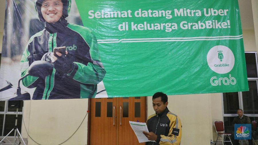 Mulai hari ini, Grab dan Uber merger.