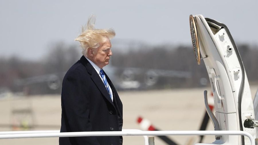 U.S. President Donald Trump boards Air Force One before departing Joint Base Andrews, Maryland en route West Virginia, U.S., April 5, 2018. REUTERS/Kevin Lamarque
