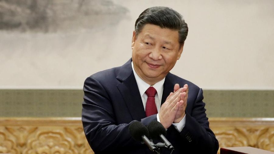 FILE PHOTO: China's President Xi Jinping claps after his speech as he and other new Politburo Standing Committee members meet with the press at the Great Hall of the People in Beijing, China October 25, 2017. REUTERS/Jason Lee
