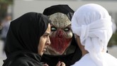 Seorang penggemar kostum unik menghadiri Film & Comic Con Timur Tengah di Dubai. (AFP PHOTO / KARIM SAHIB)