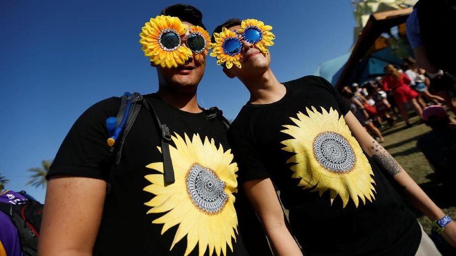 Concertgoers pose at the Coachella Valley Music and Arts Festival in Indio, California, U.S., April 14, 2018. Picture taken April 14, 2018. REUTERS/Mario Anzuoni