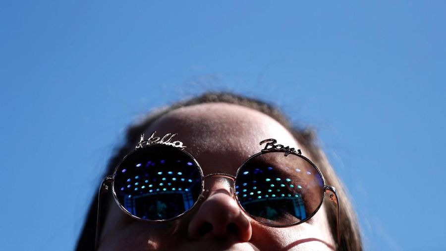 A concertgoer watches a performance by Nile Rodgers at the Coachella Valley Music and Arts Festival in Indio, California, U.S., April 14, 2018. Picture taken April 14, 2018. REUTERS/Mario Anzuoni