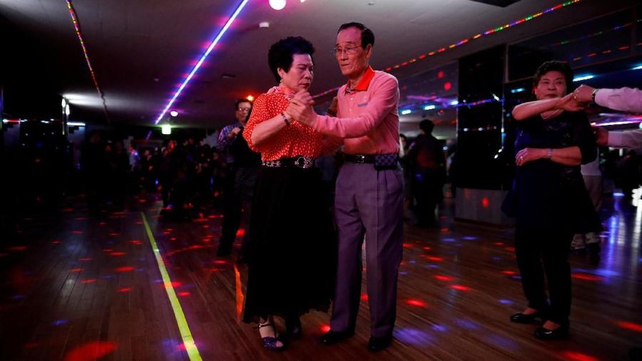 Han Min-ja and Yang Won-ju dance at the New Hyundai Core colatec in Seoul, South Korea, April 10, 2018. Picture taken April 10, 2018. To match Feature SOUTHKOREA-AGEING/DISCOS REUTERS/Kim Hong-Ji TPX IMAGES OF THE DAY