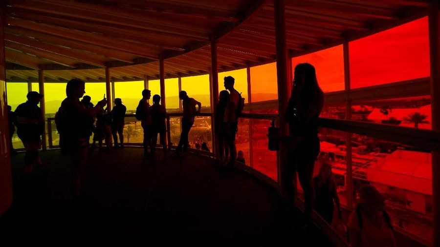 Concertgoers stand inside an installation called 