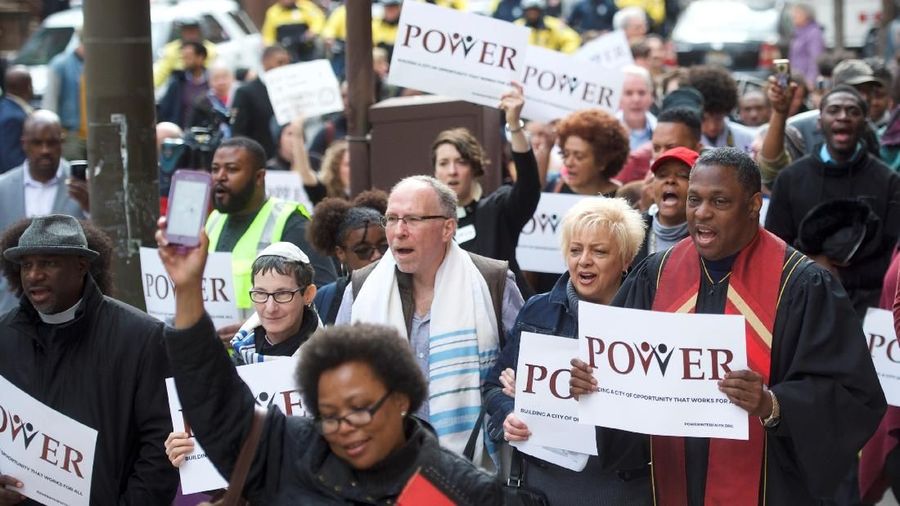 Interfaith clergy leaders march from the Center City Starbucks, where two black men were arrested, to other nearby stores in Philadelphia, Pennsylvania U.S. April 16, 2018.  REUTERS/Mark Makela