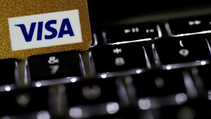 FILE PHOTO: A Visa credit card is seen on a computer keyboard in this picture illustration taken September 6, 2017. REUTERS/Philippe Wojazer