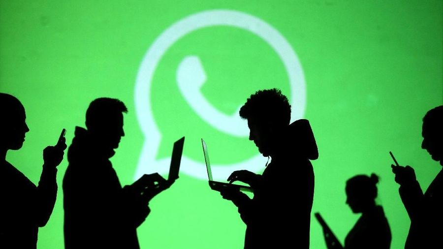 REFILE - CLARIFYING CAPTION Silhouettes of mobile users are seen next to logos of social media apps Signal, Whatsapp and Telegram projected on a screen in this picture illustration taken March 28, 2018.  REUTERS/Dado Ruvic