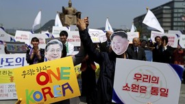 FOTO: Gema Satu Korea Sambut Pertemuan Kim Jong-un dan Moon