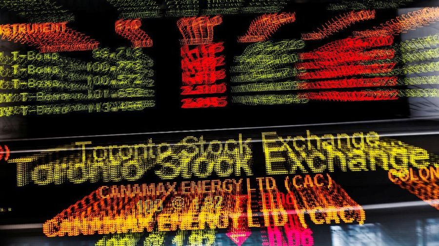 FILE PHOTO:    A sign board displaying Toronto Stock Exchange (TSX) stock information is seen in Toronto June 23, 2014. Canada's main stock index was little changed on Monday as weakness in financial and energy shares offset gains in the materials sector.   REUTERS/Mark Blinch