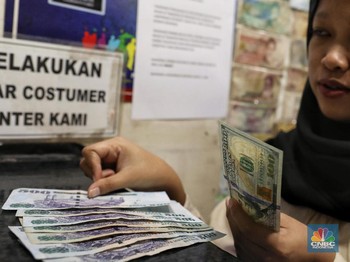 Pukul 12.00 WIB: Dolar AS Masih Dekati Rp 14.100