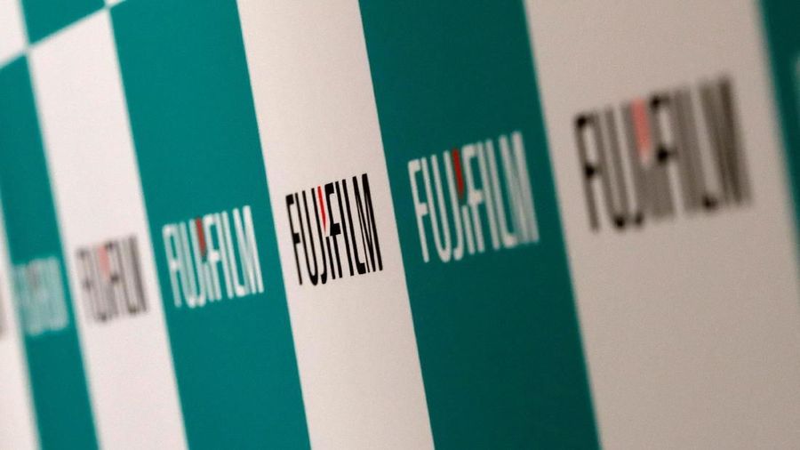 FILE PHOTO: Fujifilm Holdings' logos are pictured ahead of its news conference in Tokyo, Japan January 31, 2018. REUTERS/Kim Kyung-Hoon/File Photo                     GLOBAL BUSINESS WEEK AHEAD