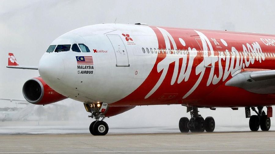 FILE PHOTO: An AirAsia X Airbus A340 passenger jet arrives on its inaugural flight from Kuala Lumpur to Paris Orly Airport February 14, 2011.  REUTERS/Charles Platiau