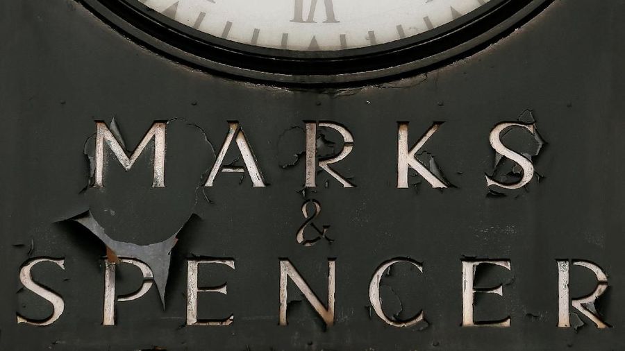 FILE PHOTO: A Marks & Spencer sign is seen outside outside a store in London January 8, 2014. REUTERS/Stefan Wermuth