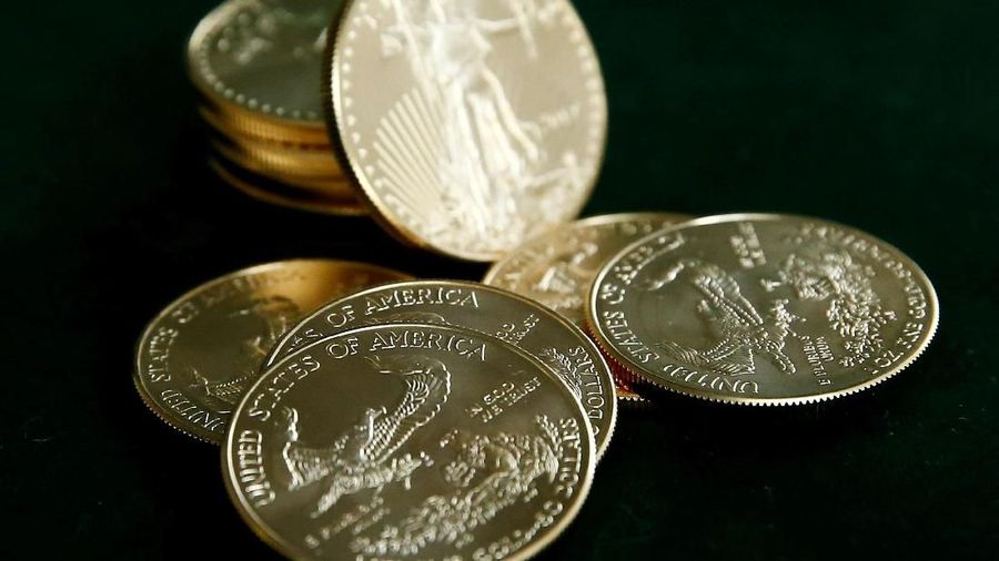 FILE PHOTO: Gold U.S. dollar bullion coins are seen in this photo illustration taken in Moscow, Russia, August 4, 2017. REUTERS/Maxim Shemetov