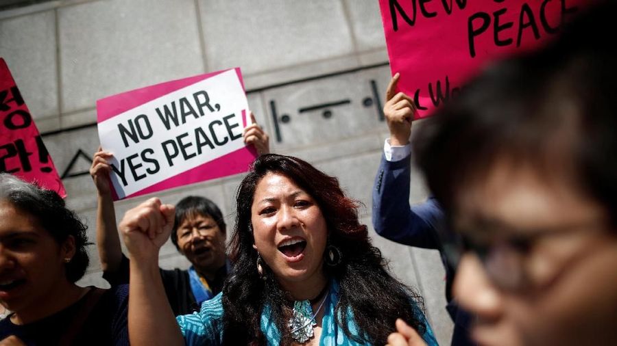 Women attend a protest against U.S. President Donald Trump near U.S. embassy in Seoul, South Korea, May 25, 2018. REUTERS/Kim Hong-Ji
