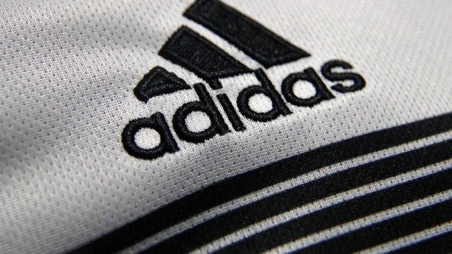 FILE PHOTO: An Adidas sign is seen before the company's annual news conference in Herzogenaurach, Germany March 14, 2018. REUTERS/Michael Dalder/File Photo                        GLOBAL BUSINESS WEEK AHEAD