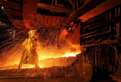A worker uses the tapping process to separate nickel ore from other elements at a nickel processing plant in Sorowako, South Sulawesi Province, Indonesia March 1, 2012. REUTERS/Yusuf Ahmad
