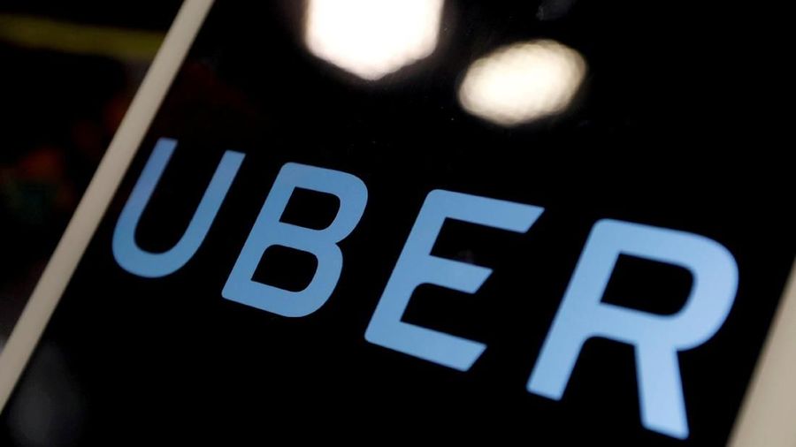 FILE PHOTO: The logo of Uber is seen on an iPad, during a news conference to announce Uber resumes ride-hailing service, in Taipei, Taiwan April 13, 2017. REUTERS/Tyrone Siu/File Photo
