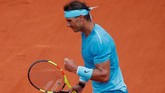 Rafael Nadal menegaskan status raja tanah liat dengan memenangi turnamen grand slam Perancis Terbuka 2018. Secara keseluruhan, Nadal telah menjadi juara di Perancis sebanyak 11 kali. (REUTERS/Charles Platiau)