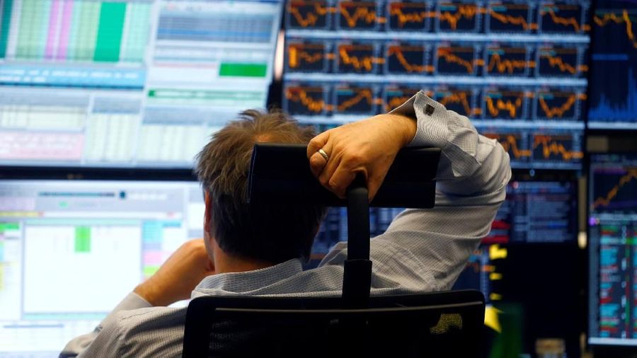 FILE PHOTO: A trader works at Frankfurt's stock exchange in Frankfurt, Germany, April 6, 2018. REUTERS/Ralph Orlowski/File Photo