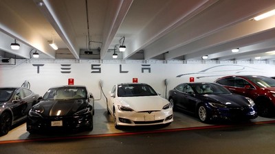 Tesla Model 3s and X's are shown charging in an underground parking lot next to a Tesla store in San Diego,California, U.S., May 30, 2018. REUTERS/Mike Blake