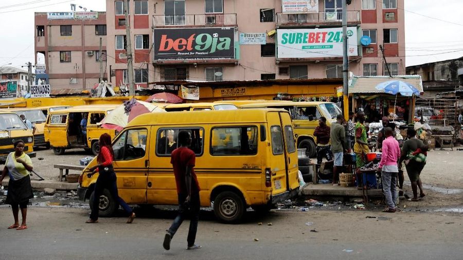 Banners advertising betting companies are seen hanging on a building in Ojuelegbe district in Lagos, Nigeria, June 21, 2018. Picture taken June 21, 2018. REUTERS/Akintunde Akinleye