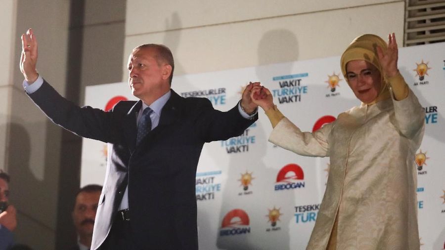 Turkish President Tayyip Erdogan and his wife Emine Erdogan greet supporters at the AKP headquarters in Ankara, Turkey June 25, 2018. REUTERS/Umit Bektas