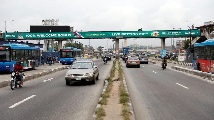 A banner advertising betting company, Bet9ja is seen across a pedestrian bridge in Ojuelegbe district in Lagos, Nigeria, June 21, 2018.Picture taken June 21, 2018. REUTERS/Akintunde Akinleye