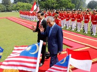 Senyum dan Sambutan Hangat Jokowi untuk Mahathir Mohamad