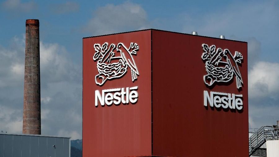 FILE PHOTO: A Nestle logo is pictured on a coffee factory in Orbe, Switzerland May 31, 2018. Picture taken May 31, 2018. REUTERS/Denis Balibouse/File Photo