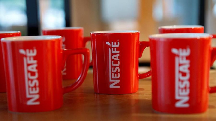 FILE PHOTO: Nescafe mugs are pictured at Nestle Research Center in Orbe, Switzerland May 31, 2018. Picture taken May 31, 2018. REUTERS/Denis Balibouse/File Photo