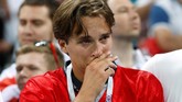 Kesedihan juga jelas terlihat dari suporter Inggris yang hadir langsung di Stadion Luzhniki. Meski demikian, mayoritas suporter Inggris memberikan pujian pada skuat asuhan Gareth Southgate. (REUTERS/Grigory Dukor)