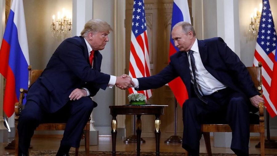U.S. President Donald Trump and Russia's President Vladimir Putin shake hands as they meet in Helsinki, Finland July 16, 2018. REUTERS/Kevin Lamarque TPX IMAGES OF THE DAY