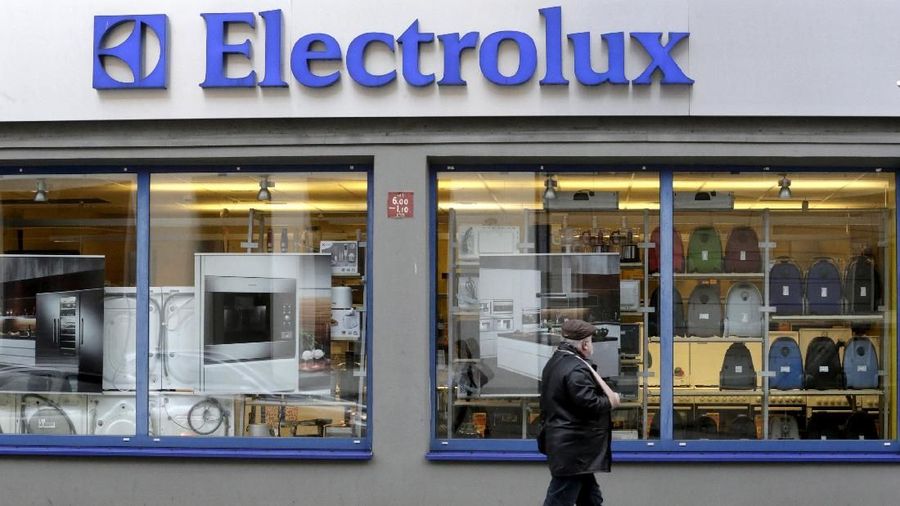 FILE PHOTO: A man walks past an Electrolux shop in Riga, Latvia November 12, 2013. REUTERS/Ints Kalnins/File Photo
