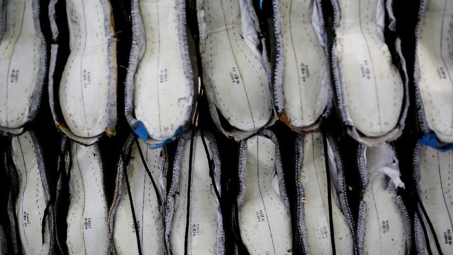 Shoes are being made at Complete Honour Footwear Industrial, a footwear factory owned by a Taiwan company, in Kampong Speu, Cambodia, July 4, 2018. REUTERS/Ann Wang SEARCH