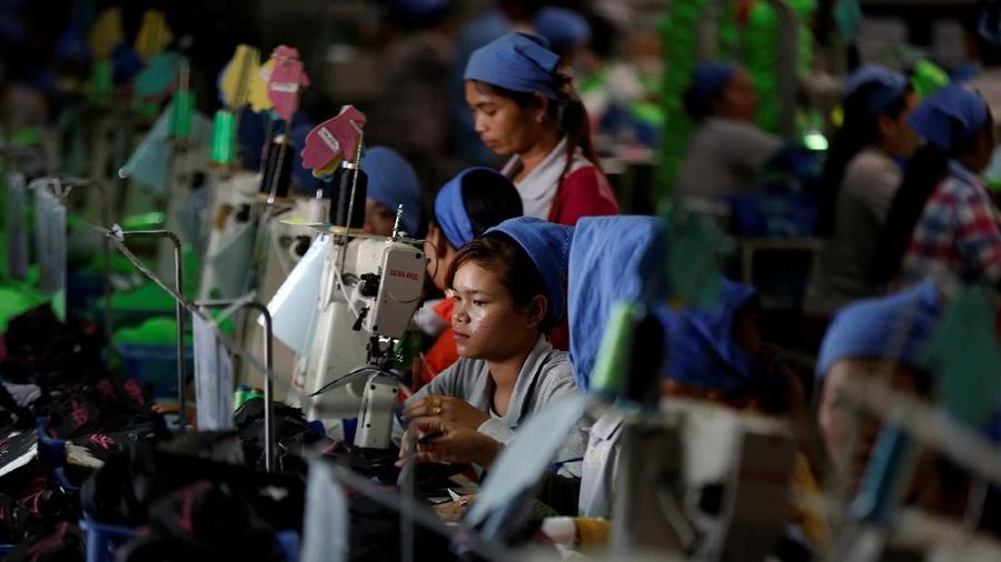 Women work on the production line at Complete Honour Footwear Industrial, a footwear factory owned by a Taiwan company, in Kampong Speu, Cambodia, July 4, 2018. REUTERS/Ann Wang    SEARCH 