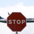 A Ryanair airplane passes a Stop sign as it lands at Barcelona-El Prat airport, the day before a cabin crew strike is to be held in European countries, in Barcelona, Spain, July 24, 2018. REUTERS/Albert Gea
