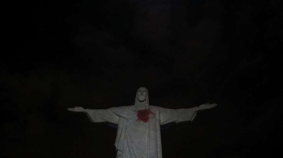 The statue of Christ the Redeemer is lit up with a red heart to launch the campaign named