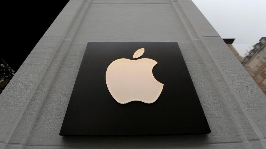 FILE PHOTO: The company's logo is seen outside Austria's first Apple store, which opens on February 24, during a media preview in Vienna, Austria, February 22, 2018. REUTERS/Heinz-Peter Bader/File Photo                  GLOBAL BUSINESS WEEK AHEAD