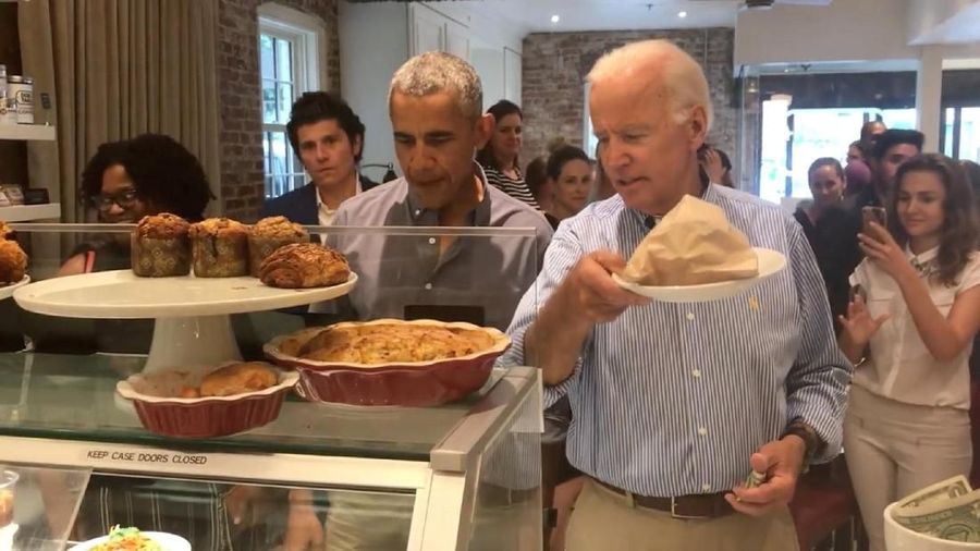 Former U.S. President Barack Obama and former Vice President Joe Biden order lunch at the Dog Tag Bakery in Washington, D.C., U.S., July 30, 2018, in this still image take from a video obtained from social media. Dog Tag Bakery/via REUTERS THIS IMAGE HAS BEEN SUPPLIED BY A THIRD PARTY. MANDATORY CREDIT. NO RESALES. NO ARCHIVES.