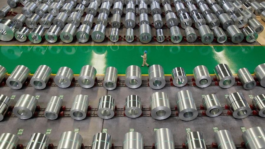 FILE PHOTO: An employee walks past columns of steel as she works at a steel production factory in Wuhan, Hubei province, August 2, 2012. REUTERS/Stringer/File Photo.   CHINA OUT. NO COMMERCIAL OR EDITORIAL SALES IN CHINA.
